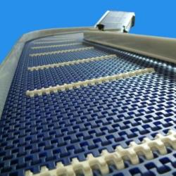 Modular Plastic Belt Conveyor with an Incline with flights